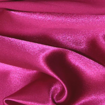 Crepe Back Satin fabric is a sophisticated and luxurious material with a sleek and glossy front surface, while the backside features a textured and matte finish. Crafted from 100% polyester fibers, this fabric is not only resistant to wrinkles but also provides insulation. It serves as a cost-effective substitute for silk. With its medium weight, Crepe Back Satin fabric drapes and flows gracefully, adding to its overall beauty.